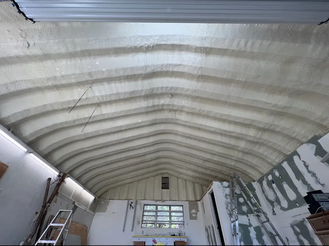 Spray polyurethane foam applied to the underside of a metal roof deck in Sarasota Springs